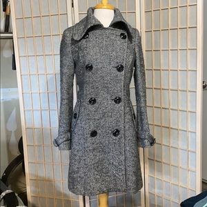 Black and white check trench coat.